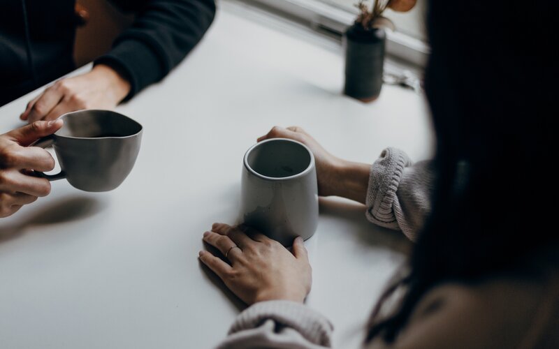 People having a conversation at a table